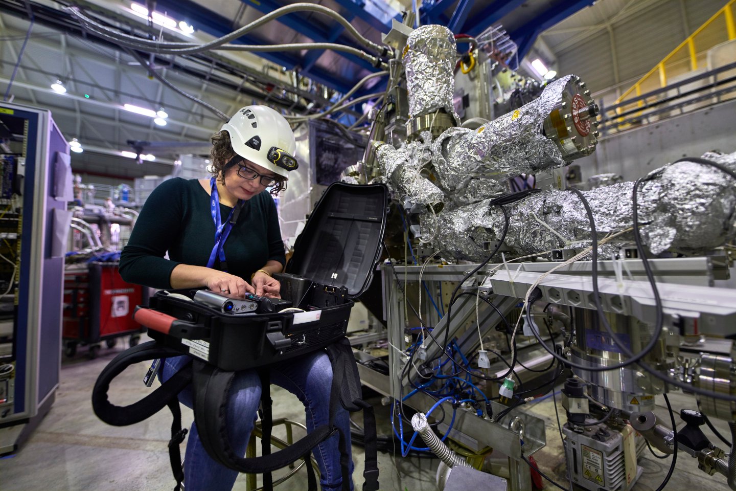 CERN scientist working on equipment